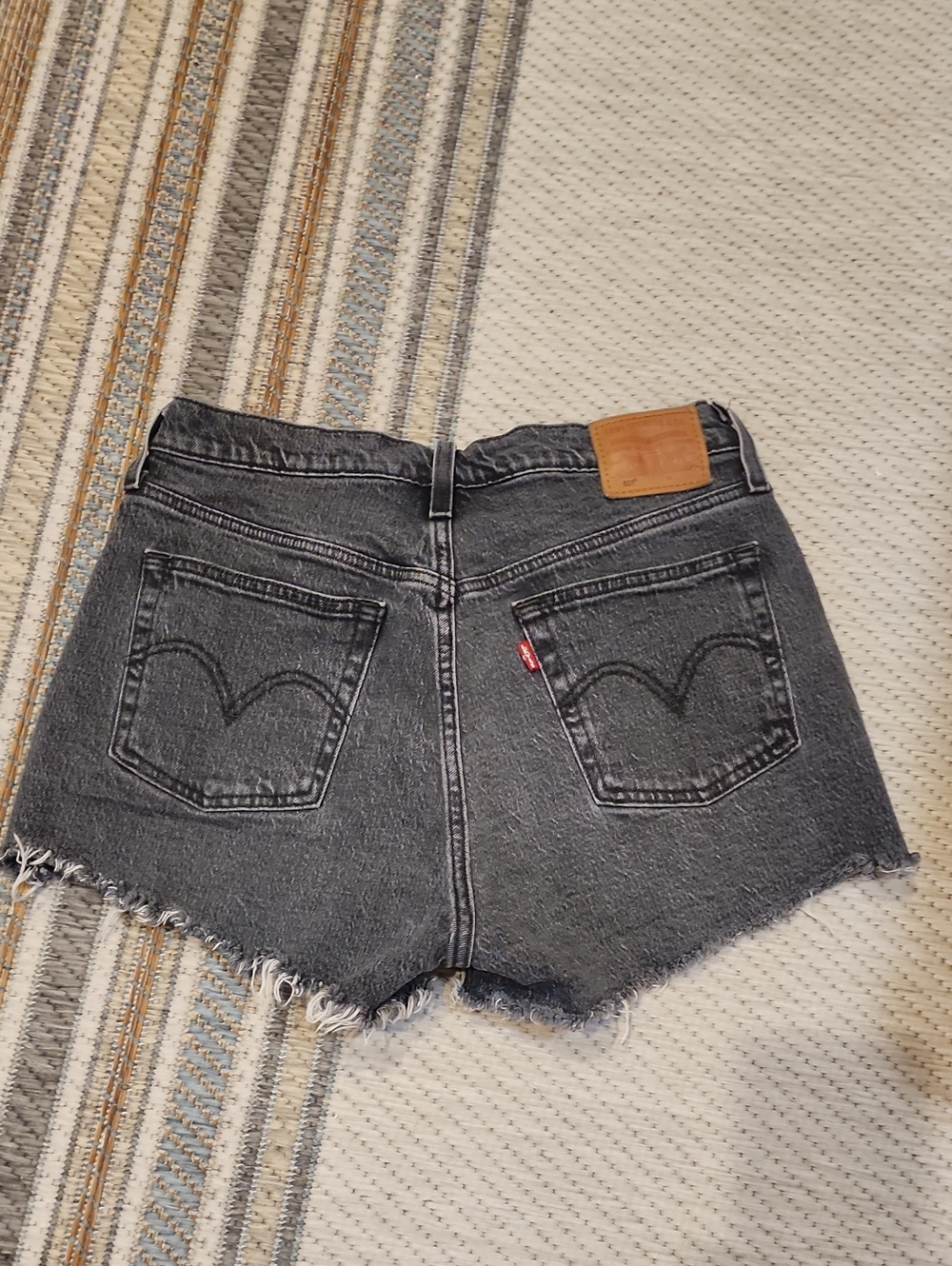 Levi's Washed Black Denim Cutoff Shorts with Frayed Hem